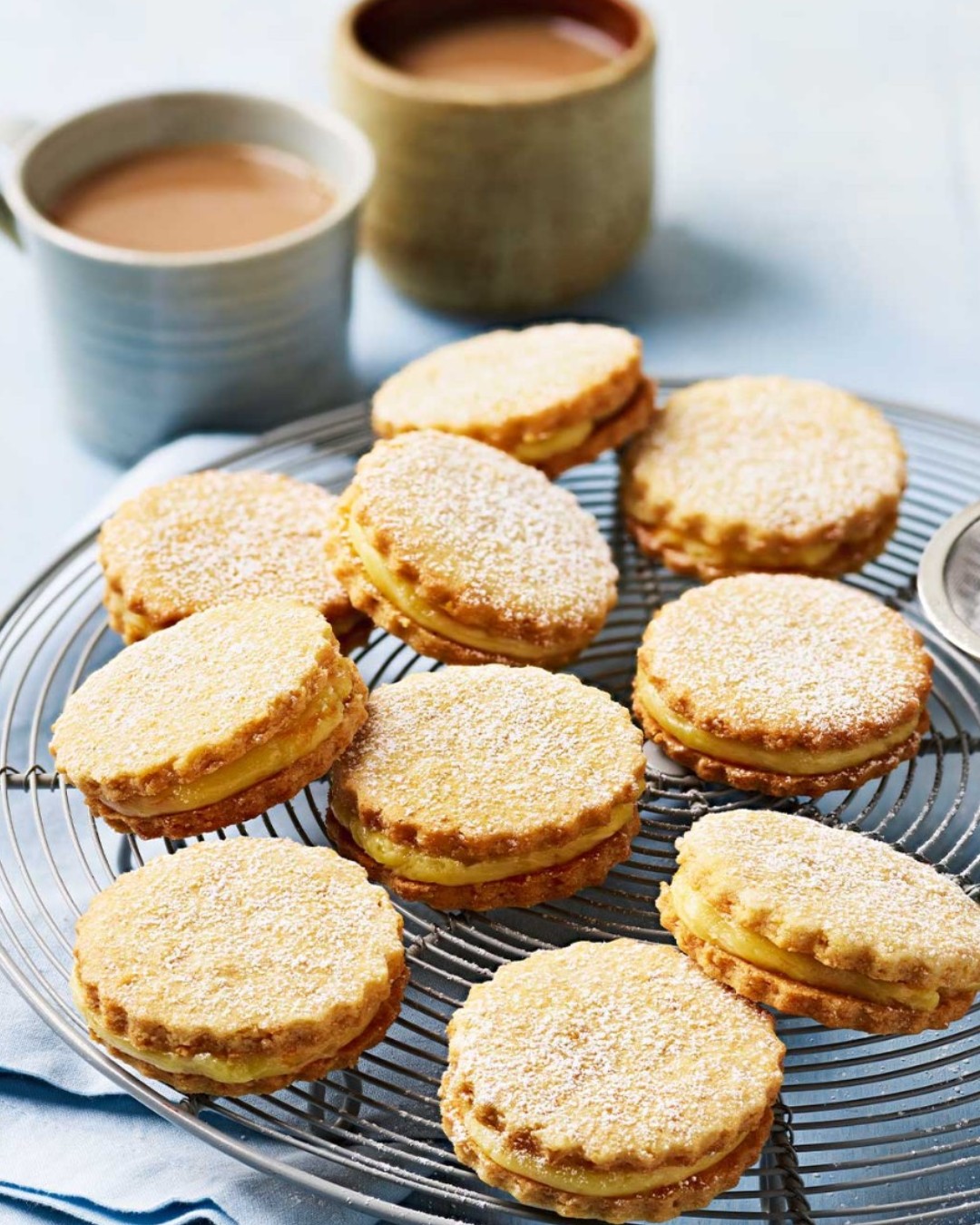 Lemon shortbread sandwich biscuits styled with tea for Sainsbury's magazine